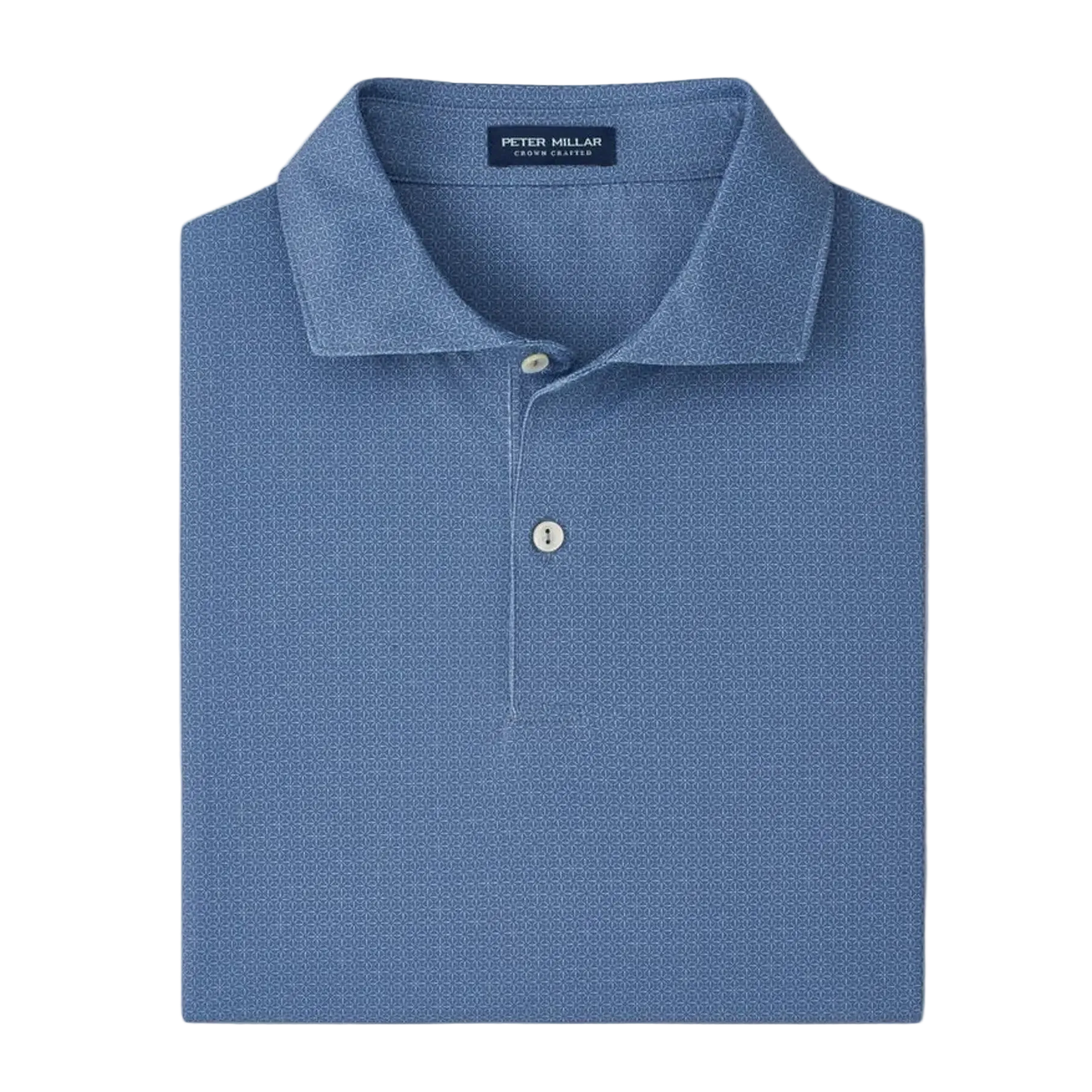 Folded blue polo shirt with 'Peter Millar' label on a light gray background