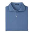 Folded blue polo shirt with 'Peter Millar' label on a light gray background