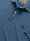 Blue polo shirt with a red logo and 'Gunn Polo' label on a white background